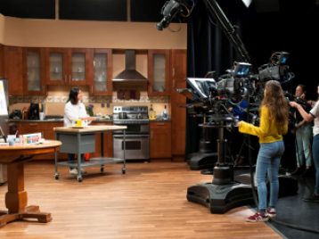 Students in Terri Sarris' SAC 302 (TV Production I) course gain practice and experience in directing multi-camera work flows in studio B 